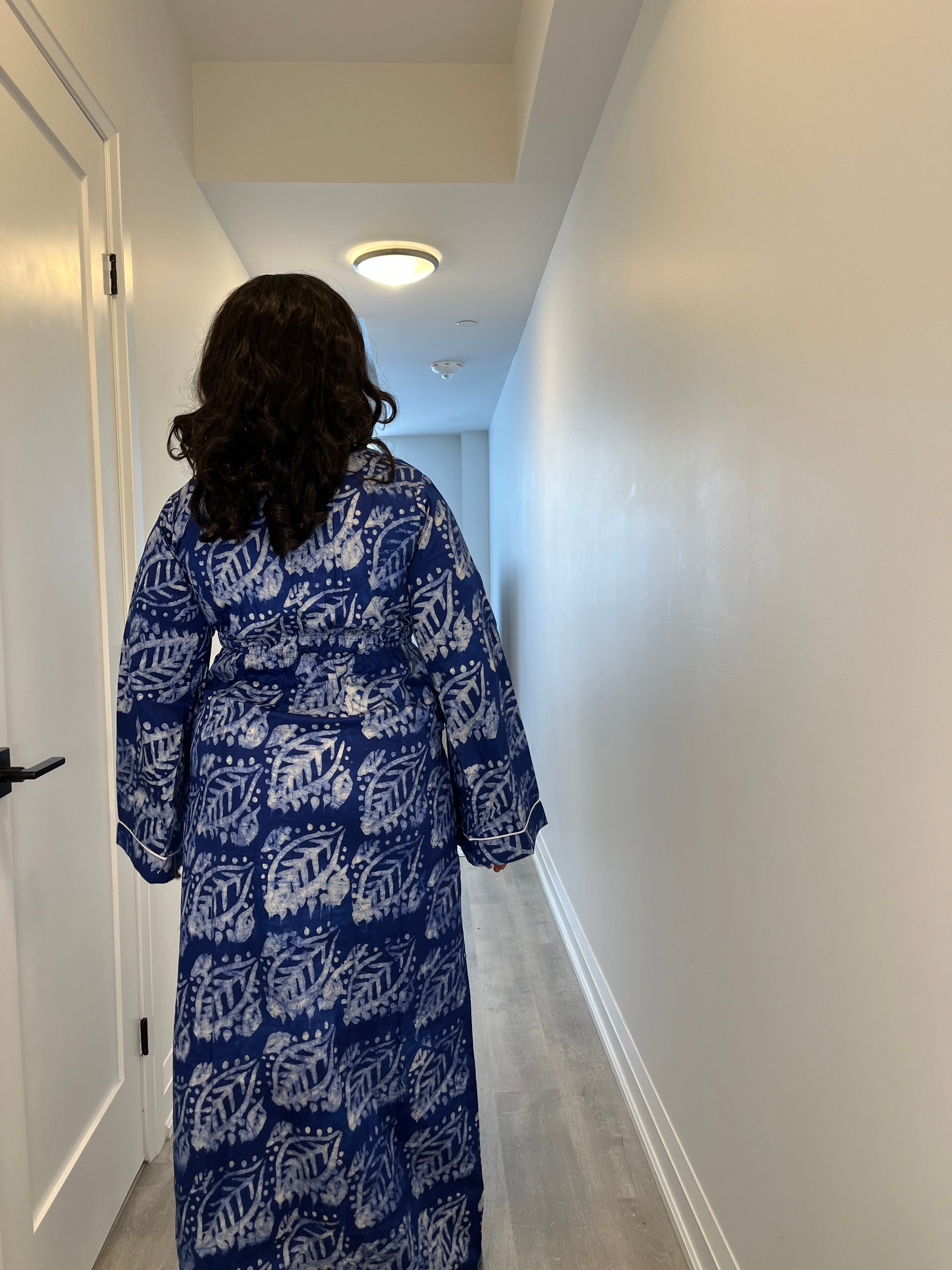 Back view of the Adire Crepe Dress Shirt showcasing its relaxed fit and handcrafted detailing in a bold blue and white leaf pattern.